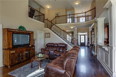 Great flow for entertaining. Notice the beautiful details - columns, wainscoting & balusters.