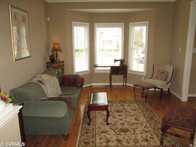 Living Room - Hardwood flooring step out bay windo