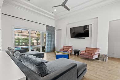 Living area featuring visible vents, light wood-style flooring, a ceiling fan, recessed lighting, and baseboards
