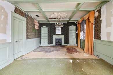 Millwork with details: Wainscoting wraps around th