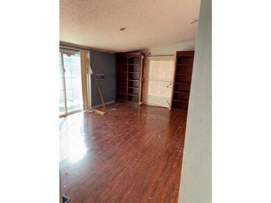 Spare room with dark hardwood / wood-style floors 