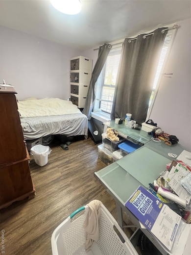 Bedroom featuring wood finished floors