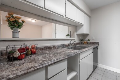 Left side of kitchen with a stainless steel double