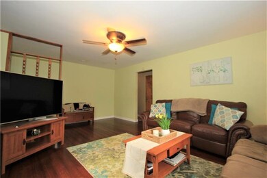 This third view of the living room shows the entry