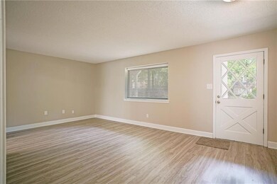 Living room with coat closet and Cape Cod style do