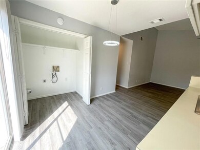 Unfurnished dining area featuring wood finished f