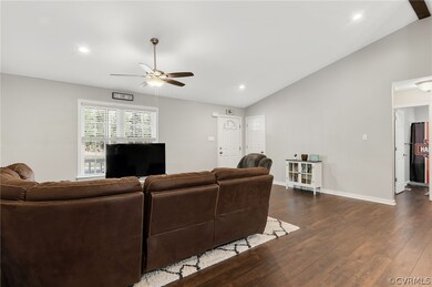Living room with dark hardwood / wood-style floori
