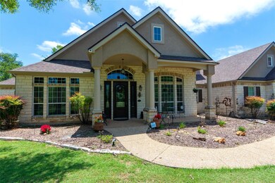 Doorway to property featuring roof with shingles,