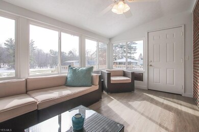 From the sunroom, enjoy views of the wooded backyard.