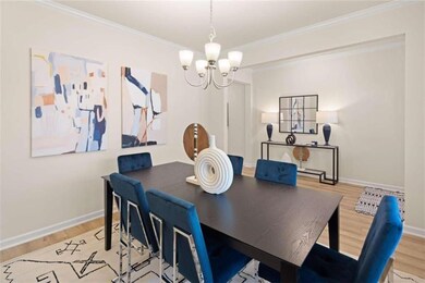 Dining space with light wood finished floors, base