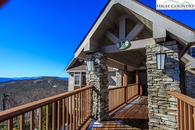 Adirondak style with stacked stone entry way