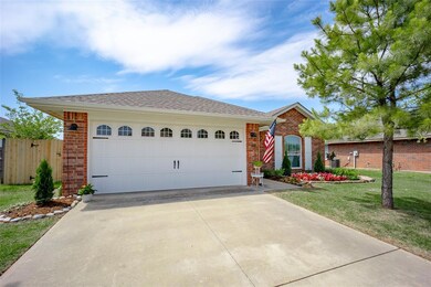 View of front of property featuring a garage and a