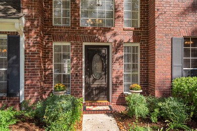 The stately red brick with the accent of the black shutters adds an elegant touch of charm.   The owner has taken such well care of the lovely landscaping and vegetation.