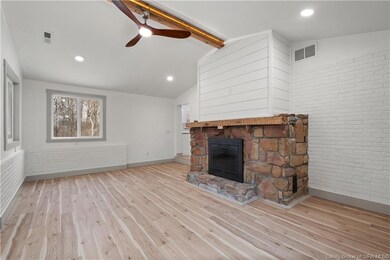 Family Room w/ woodburning fireplace