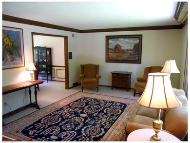 Spacious living room with double crown moldings.