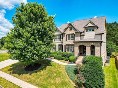 View of front of house with brick siding, a front lawn, a shingled roof, and central air condition unit