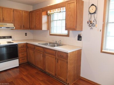 Kitchen has new flooring.