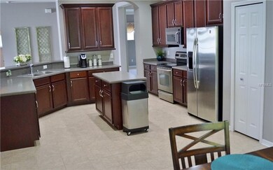 Very functional and beautiful kitchen with the crown and base molding on the cabinets. Great counter space and extra storage in the island.