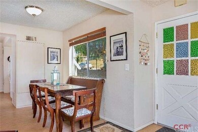 Kitchen just beyond eating nook
