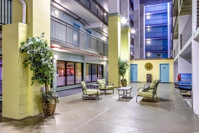 Common area with a towering ceiling