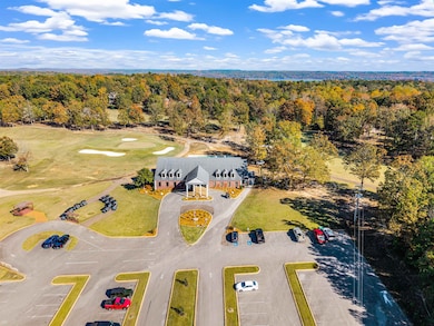 Aerial view of a golf course and a heavily wooded area