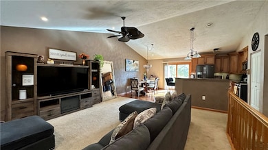 ALTERNATE VIEW OF LIVING ROOM SHOWING ENTRY TO DINING AND KITCHEN AREAS!