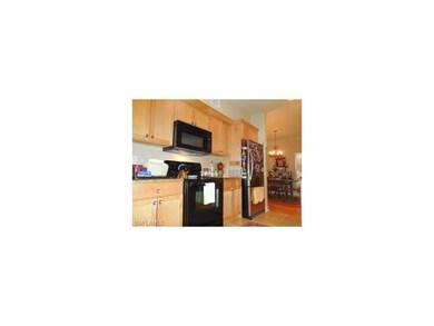 Kitchen with new electric range and microwave