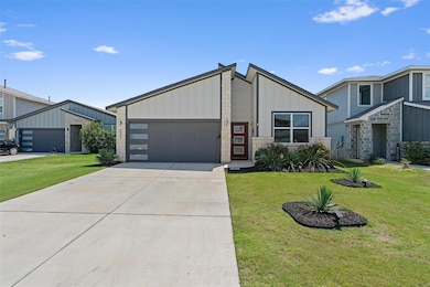 Mid-century home with an attached garage, a front