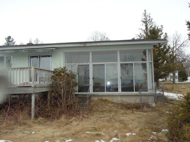behind the garage in the back of the house. facing due south.