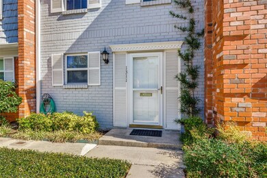 Doorway to property with brick siding