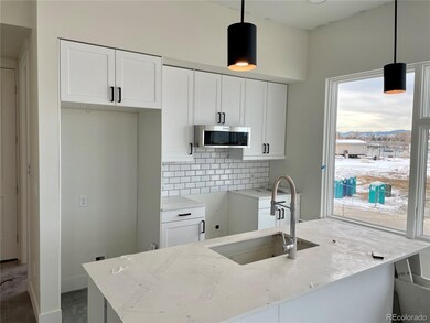 Kitchen complete with quartz countertops, soft clo