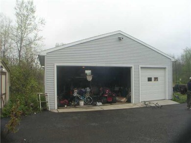 Parking Lot/Garage. Three car detached garage.