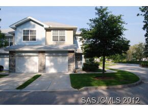 Front view of condo and garage