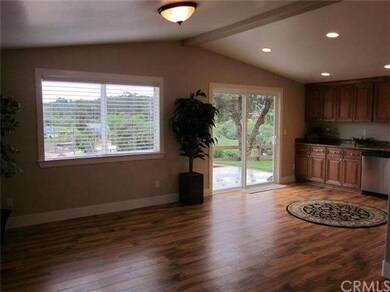View from living room to dining area with slider t