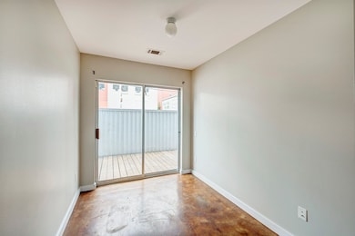 Third bedroom/bonus room with exterior views and a