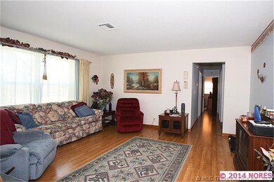 living room with hallway to bedrooms