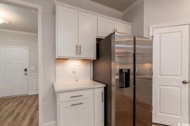 Kitchen with stainless steel fridge with ice dispe