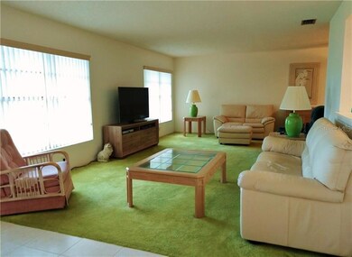 Spacious Florida room explodes with natural light.