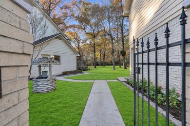 Front gate leading to the garage door on the right and the secondary door to the left that enter into the massive mud room.