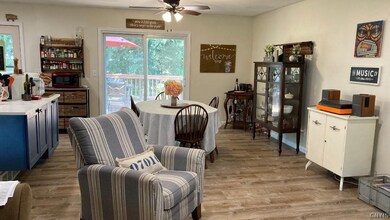 This is a new configuration and brand new luxury vinyl plank flooring.  There was a wall where the island is now, making the living room and dining are so much smaller and darker.  Major renovation!