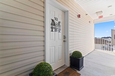 Property entrance with covered porch