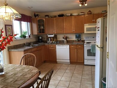Kitchen is immaculate, with a large pantry and lau