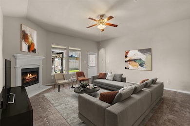 Gather the family and guests together in your lovely living room! Featuring high ceilings, dark stained ceiling fan with lighting, custom paint, gorgeous tile floors, fireplace with mantel and large windows that provide plenty of natural lighting throughout the day.