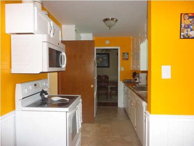 Kitchen has been recently painted Atomic Orange. A