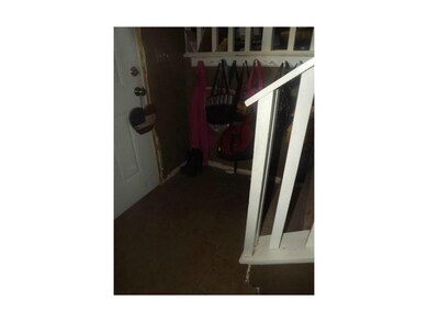 Entryway has ceramic tile floor.
