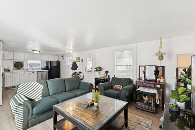 Living area with light wood-style floors