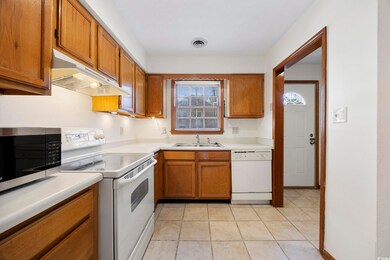 Kitchen featuring visible vents, under cabinet ran