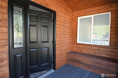 A covered porch with built-in bench seating welcomes you home!