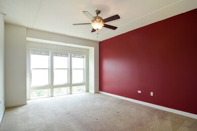 Bay window with white wood blinds adds interest to