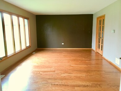 Large living room with new wood flooring